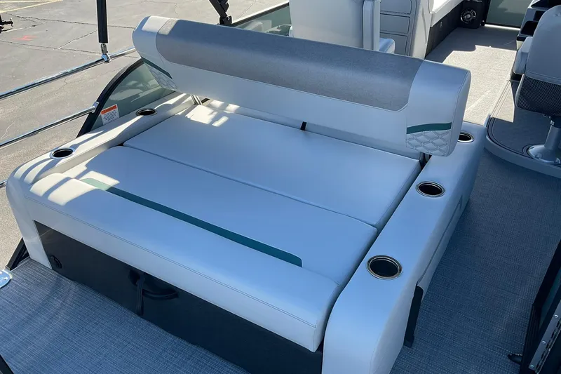 Slide: The Image of 2026 Crest Conquest 230 SLSC boat interior with cushioned seating and cup holders. - 16