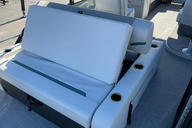 Slide: The Image of 2026 Crest Conquest 230 SLSC boat interior with white seating and cup holders. - 18