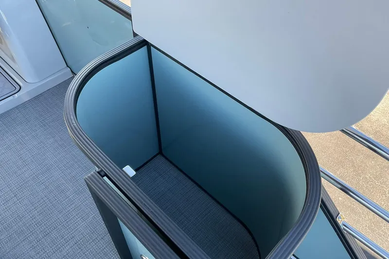 Slide: The Image of Open storage compartment on 2026 Crest Conquest 230 SLSC boat. - 21