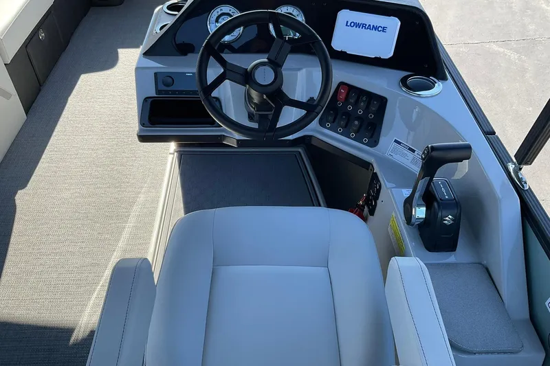 Slide: The Image of Helm of 2026 Crest Conquest 230 SLSC boat with steering wheel and controls. - 22