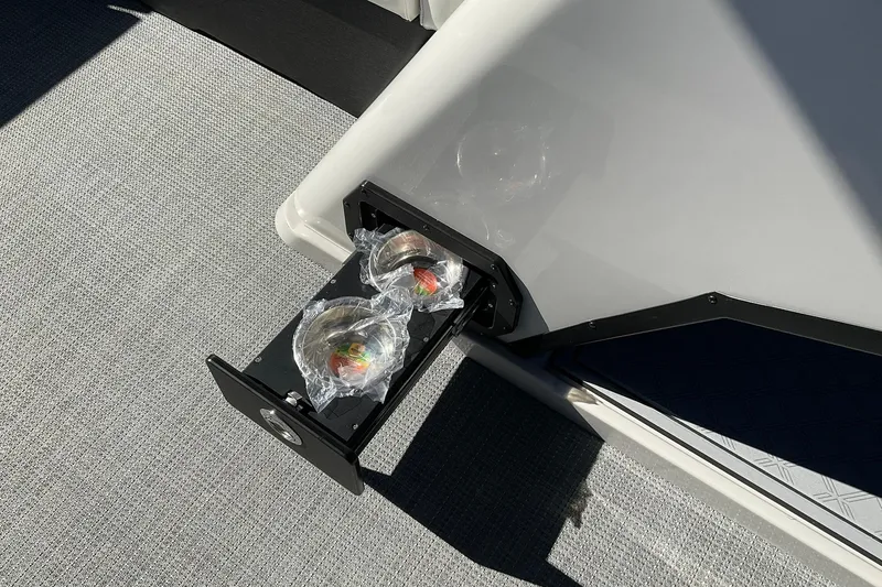 Slide: The Image of 2026 Crest Conquest 230 SLSC boat with retractable cup holders on deck. - 28