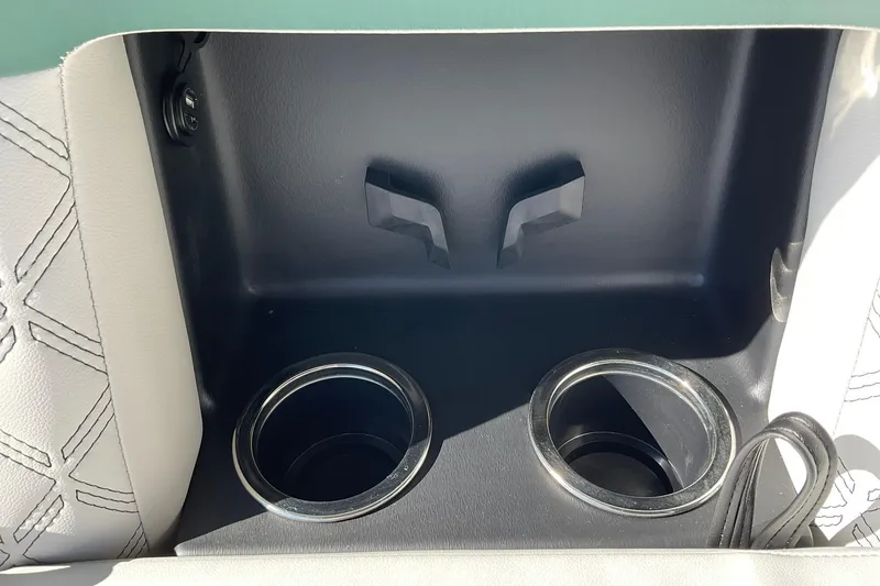 Slide: The Image of Cup holders in 2026 Crest Conquest 230 SLSC boat interior, featuring sleek design and stitching. - 31