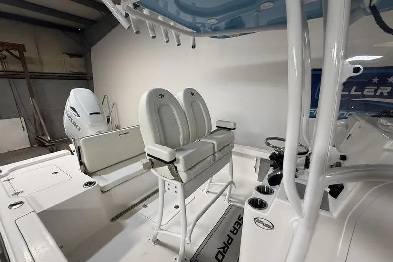 Slide: The Image of 2026 Sea Pro 250 Bay boat interior with dual seats and modern console design. - 12