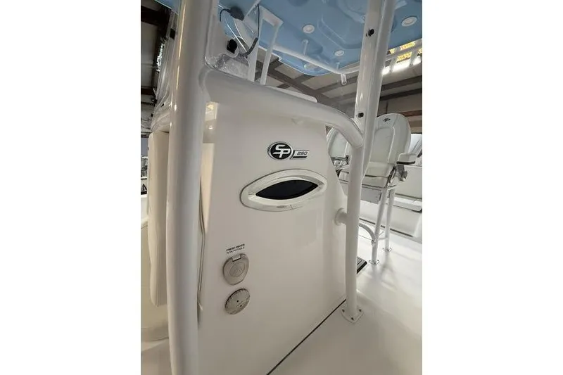 Slide: The Image of 2026 Sea Pro 250 Bay boat interior with seating and control panel. - 20