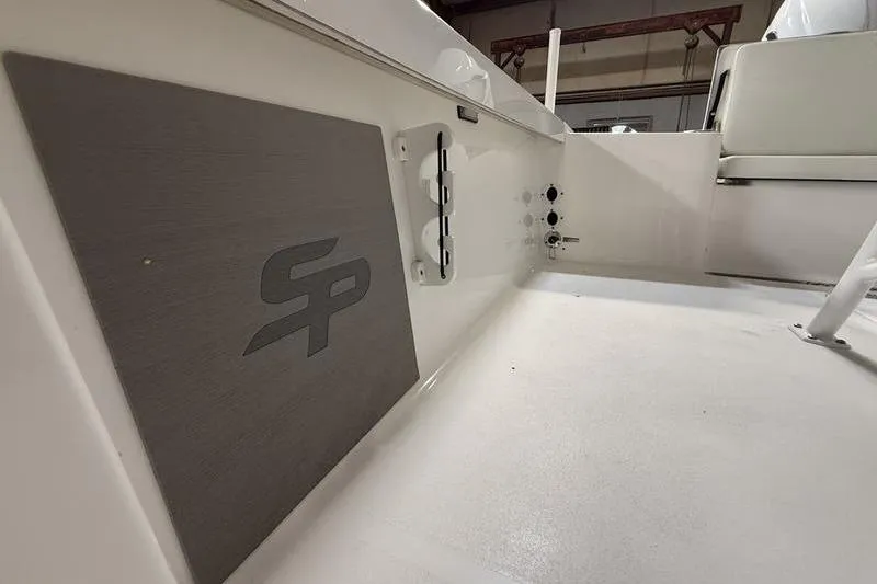 Slide: The Image of 2026 Sea Pro 250 Bay boat interior with logo and seating detail. - 23