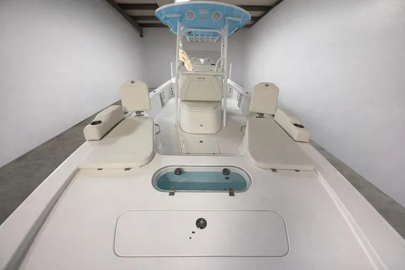 Slide: The Image of 2026 Sea Pro 250 Bay boat interior with seating and storage compartments. - 26