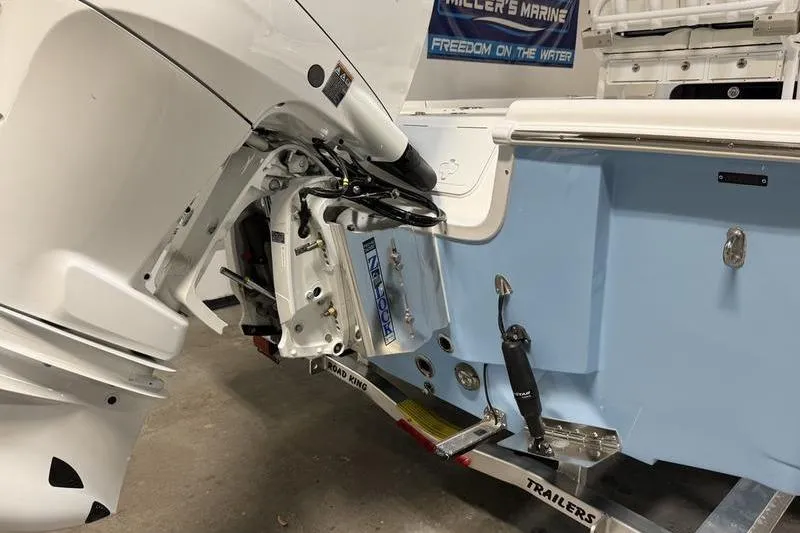 Slide: The Image of 2026 Sea Pro 250 Bay boat on trailer, showcasing engine and hull details. - 5