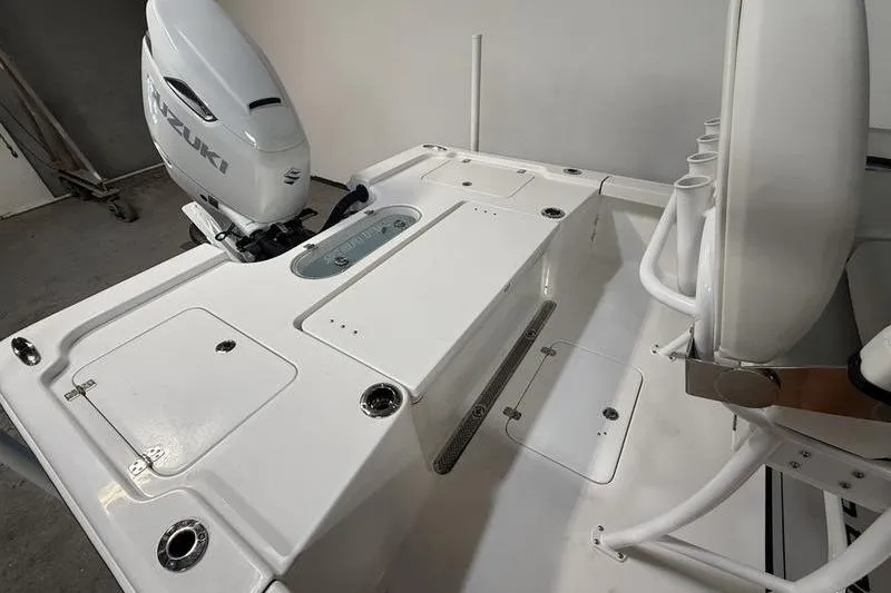 Slide: The Image of 2026 Sea Pro 250 Bay boat interior with Suzuki outboard motor. - 8