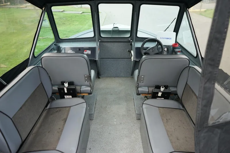 Slide: The Image of Interior of a 2010 Alumaweld Stryker Sport 20 boat with seating and steering console. - 10