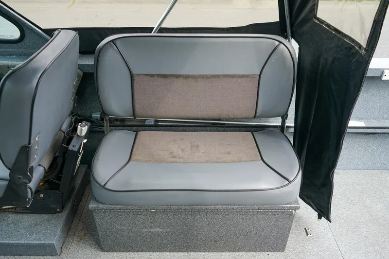 Slide: The Image of 2010 Alumaweld Stryker Sport 20 boat interior seating, gray upholstery. - 12