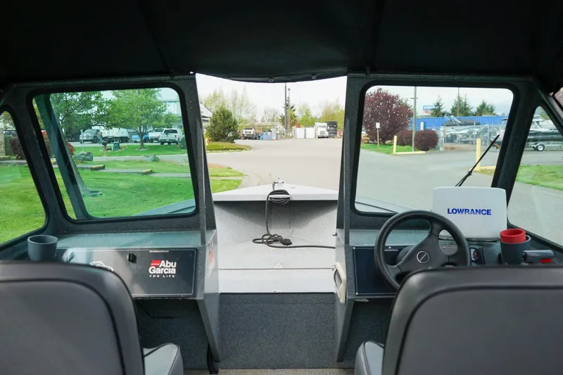 Slide: The Image of Interior view of 2010 Alumaweld Stryker Sport 20 boat with steering wheel and navigation equipment. - 18