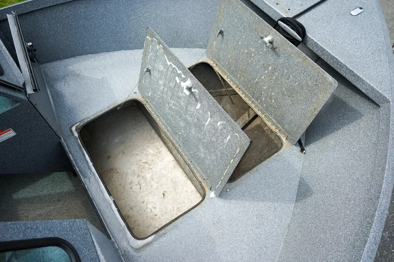 Slide: The Image of Open storage compartments on a 2010 Alumaweld Stryker Sport 20 boat deck. - 20