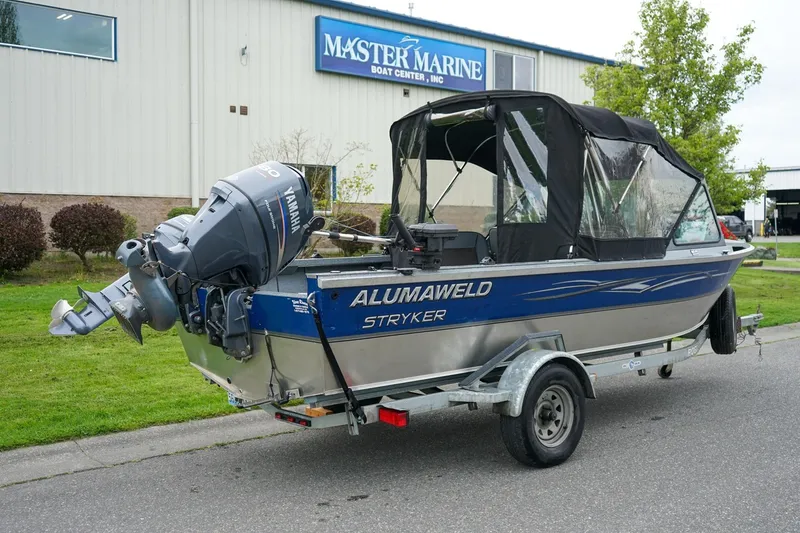 Slide: The Image of 2010 Alumaweld Stryker Sport 20 boat on trailer outside Master Marine Boat Center. - 4