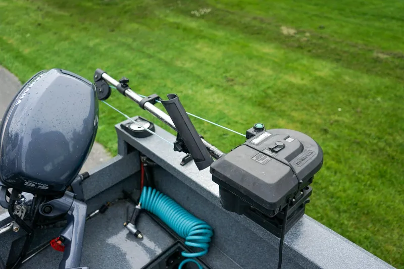 Slide: The Image of 2010 Alumaweld Stryker Sport 20 boat with motor and fishing equipment. - 9