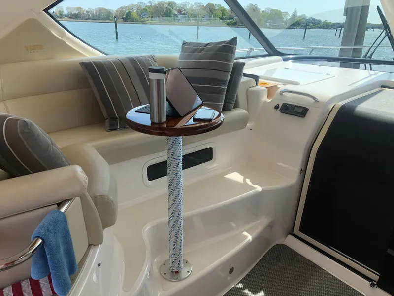 Slide: The Image of Interior of 2009 Tiara Yachts 4300 Sovran with table and cushions. - 11