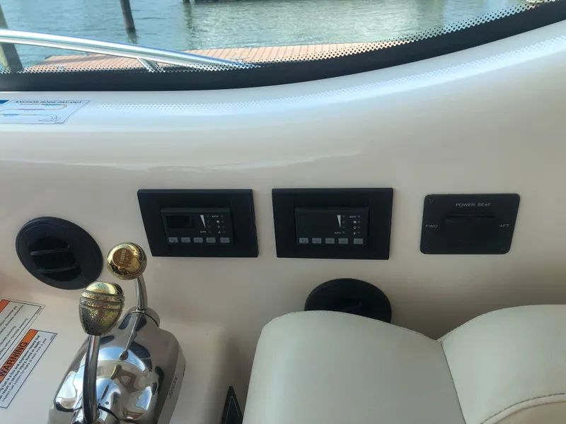 Slide: The Image of Dashboard of 2009 Tiara Yachts 4300 Sovran with controls. - 12