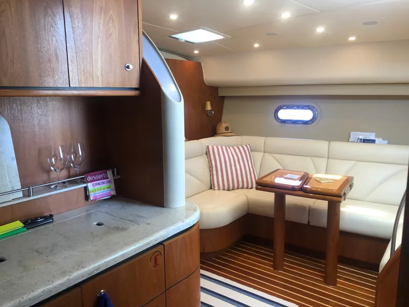 Slide: The Image of Interior of 2009 Tiara Yachts 4300 Sovran with elegant seating area. - 16