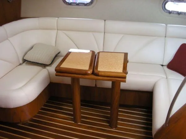Slide: The Image of Interior of 2009 Tiara Yachts 4300 Sovran with white sofa and wooden table. - 19