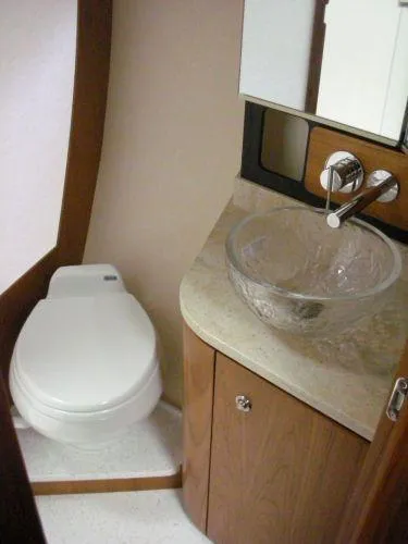 Slide: The Image of Luxurious bathroom of 2009 Tiara Yachts 4300 Sovran with glass sink. - 26