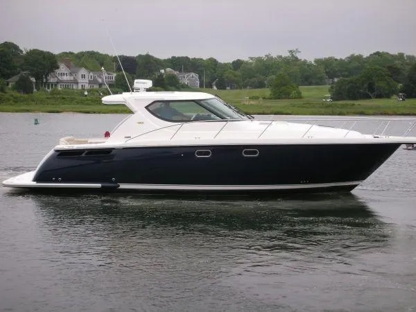 Slide: The Image of 2009 Tiara Yachts 4300 Sovran on calm water. - 3