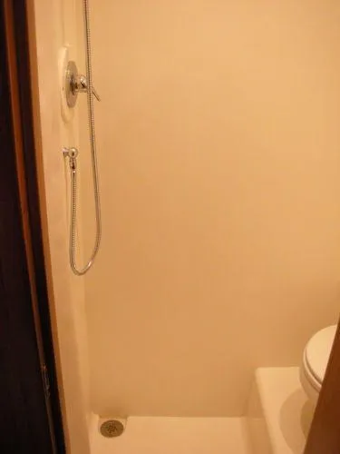 Slide: The Image of Shower and toilet in a 2009 Tiara Yachts 4300 Sovran. - 34