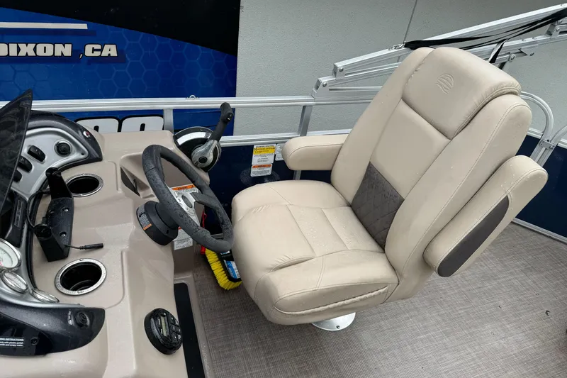 Slide: The Image of Captain's chair and helm of 2021 Sun Tracker Party Barge 20 DLX pontoon boat. - 13