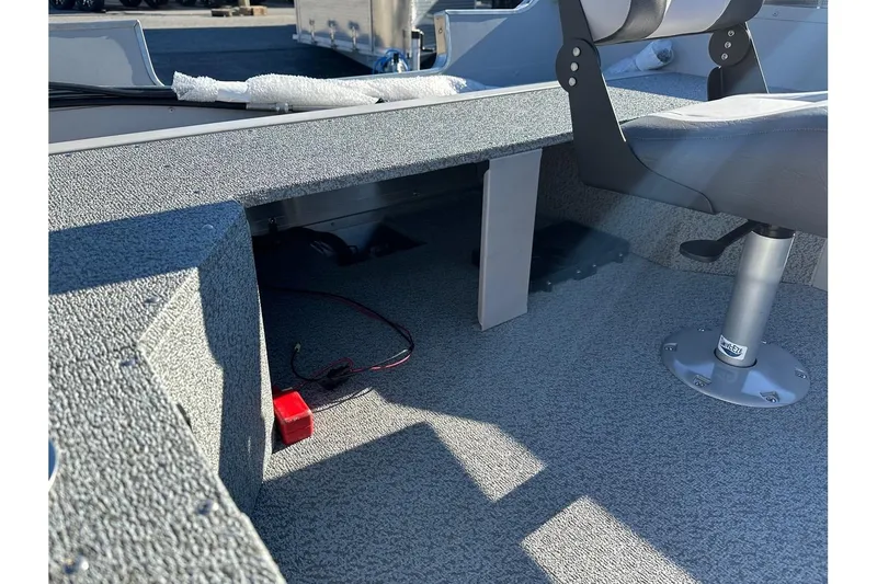 Slide: The Image of 2026 Smoker Craft Angler 16 SC boat interior with seating and storage area. - 11