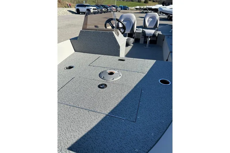 Slide: The Image of 2026 Smoker Craft Angler 16 SC boat interior with steering console and seating. - 15