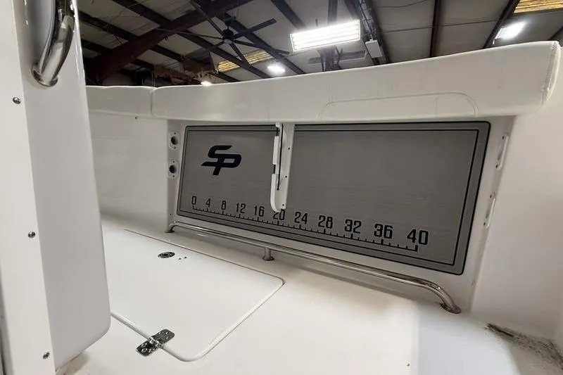 Slide: The Image of 2026 Sea Pro 262 DLX boat interior with measurement scale and logo. - 22