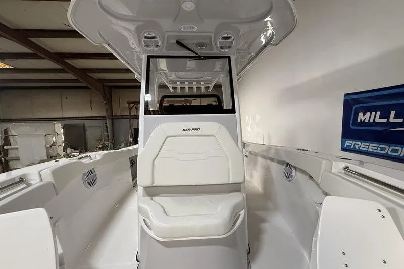Slide: The Image of 2026 Sea Pro 262 DLX boat interior with white seating and modern design. - 27