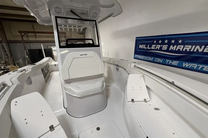 Slide: The Image of 2026 Sea Pro 262 DLX boat interior at Miller's Marina showroom. - 29