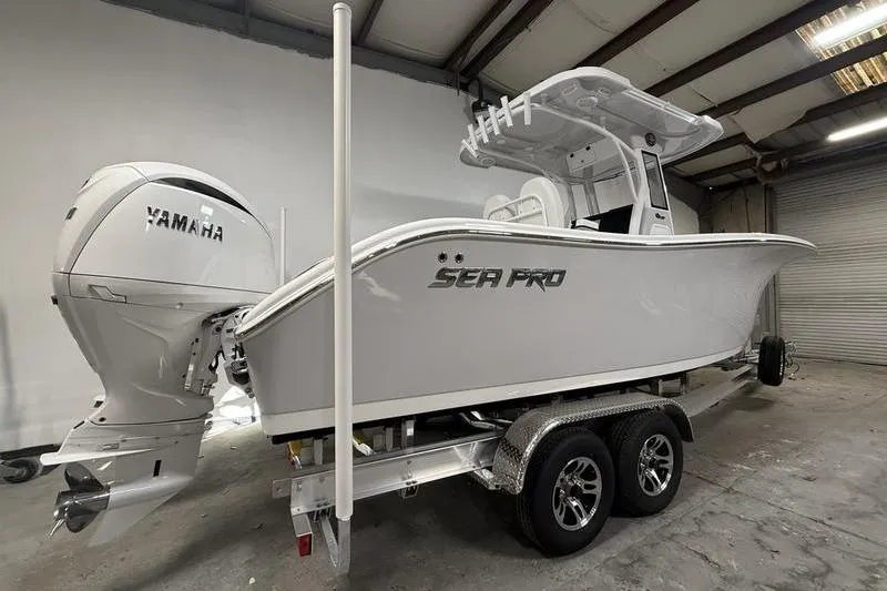 Slide: The Image of 2026 Sea Pro 262 DLX boat with Yamaha engine on trailer in warehouse. - 3