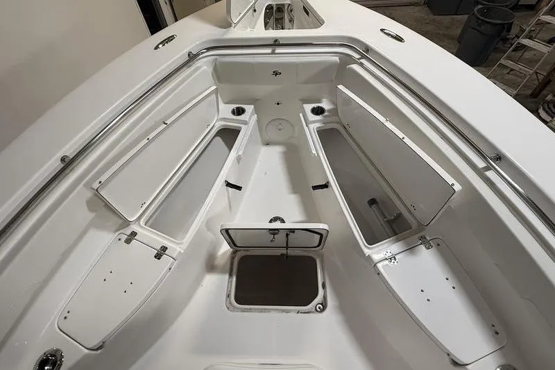 Slide: The Image of 2026 Sea Pro 262 DLX boat interior with open storage compartments. - 33