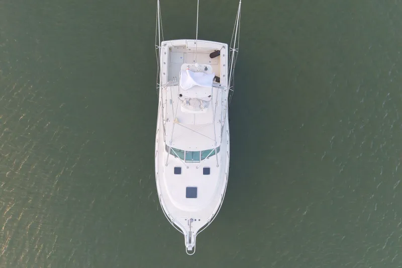 Slide: The Image of Aerial view of 2000 Pursuit 3400 Express boat on calm water. - 12