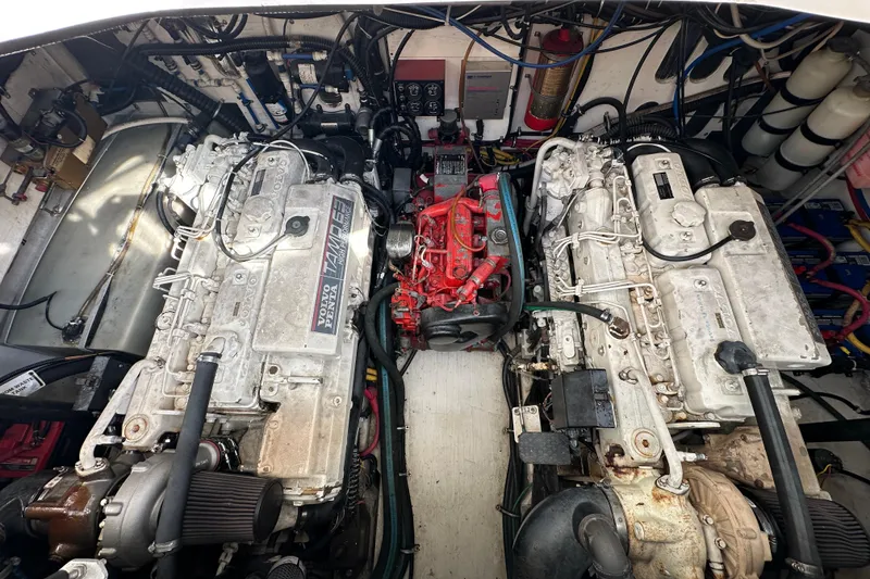 Slide: The Image of Engine room of a 2000 Pursuit 3400 Express boat, featuring dual Volvo Penta engines. - 17
