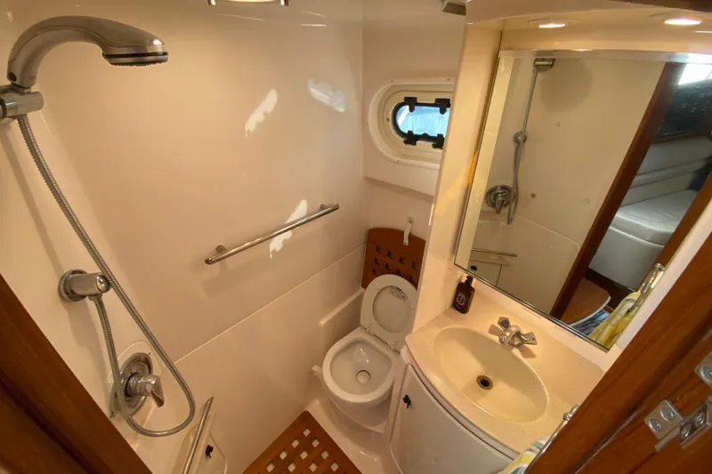 Slide: The Image of Bathroom interior of 2000 Pursuit 3400 Express boat with shower and sink. - 23