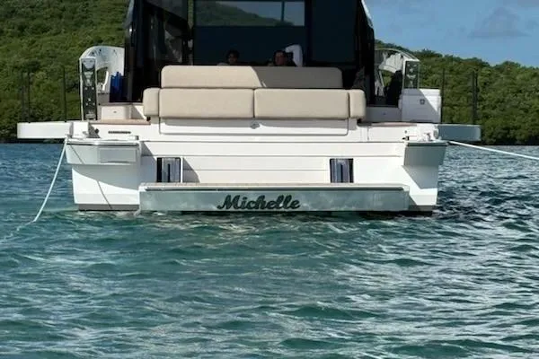 Slide: The Image of 2025 Azimut SeaDeck6 yacht named Michelle on tranquil water. - 4