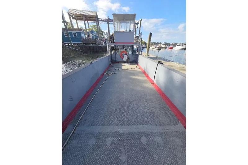 Slide: The Image of 2012 Cool Amphibious Manufacturers International Landing Craft docked by the waterfront. - 17