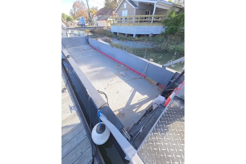 Slide: The Image of Amphibious landing craft by Cool Amphibious Manufacturers International, 2012 model, docked near a house. - 18
