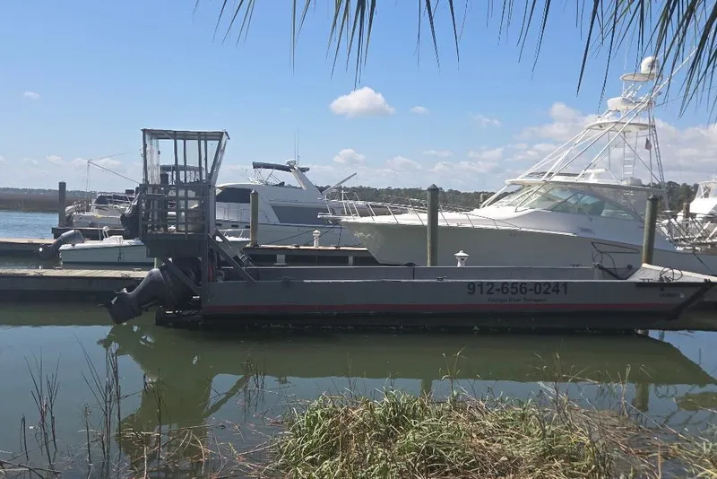 Slide: The Image of Amphibious landing craft by Cool Amphibious Manufacturers International, docked alongside yachts, 2012 model. - 2