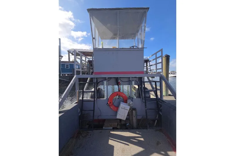 Slide: The Image of Amphibious landing craft by Cool Amphibious Manufacturers International, 2012 model, docked at a marina. - 7
