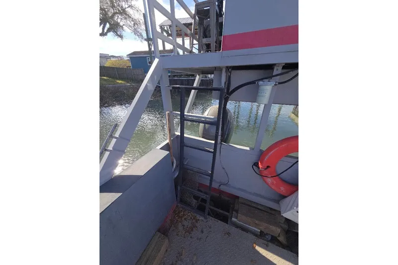Slide: The Image of Amphibious landing craft by Cool Amphibious Manufacturers International, 2012, docked with ladder and lifebuoy. - 8
