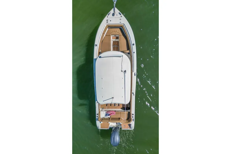 Slide: The Image of Overhead view of 2021 Sea Hunt Ultra 255 SE boat on green water. - 6