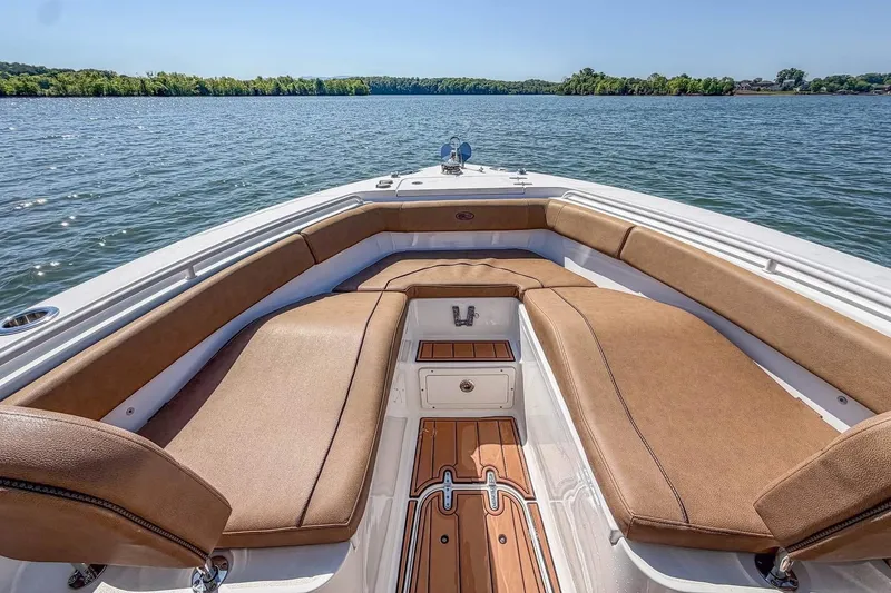 Slide: The Image of Luxurious seating on 2021 Sea Hunt Ultra 255 SE boat, cruising on a serene lake. - 8