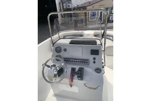 Slide: The Image of 2021 Hurricane Center Console 19 OB boat dashboard with steering wheel and controls. - 5