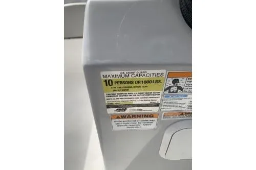Slide: The Image of Capacity label on 2021 Hurricane Center Console 19 OB, max 10 persons or 1800 lbs. - 9