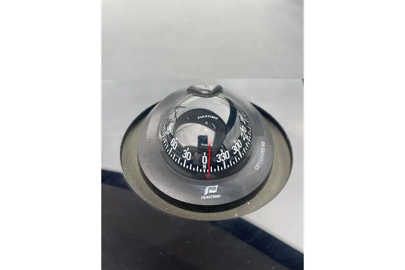 Slide: The Image of Compass on 2017 Jeanneau Leader 46 yacht dashboard, featuring Plastimo Offshore 95 model. - 22