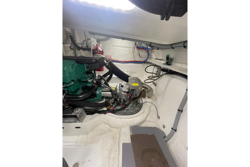Slide: The Image of Engine room of 2017 Jeanneau Leader 46 yacht, showcasing mechanical components and wiring. - 57