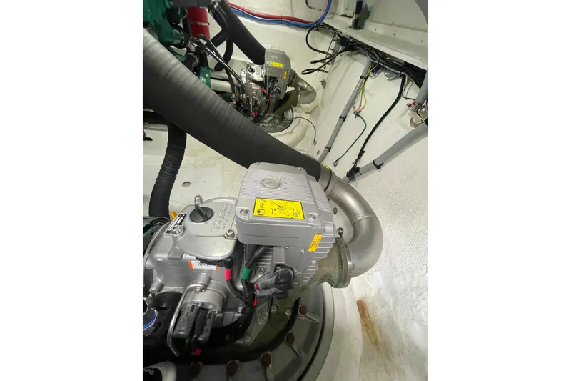 Slide: The Image of Engine compartment of a 2017 Jeanneau Leader 46 boat, showcasing mechanical components. - 58