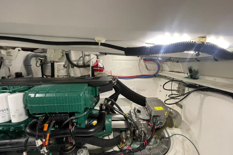 Slide: The Image of Engine room of a 2017 Jeanneau Leader 46 yacht, showcasing mechanical components and wiring. - 59